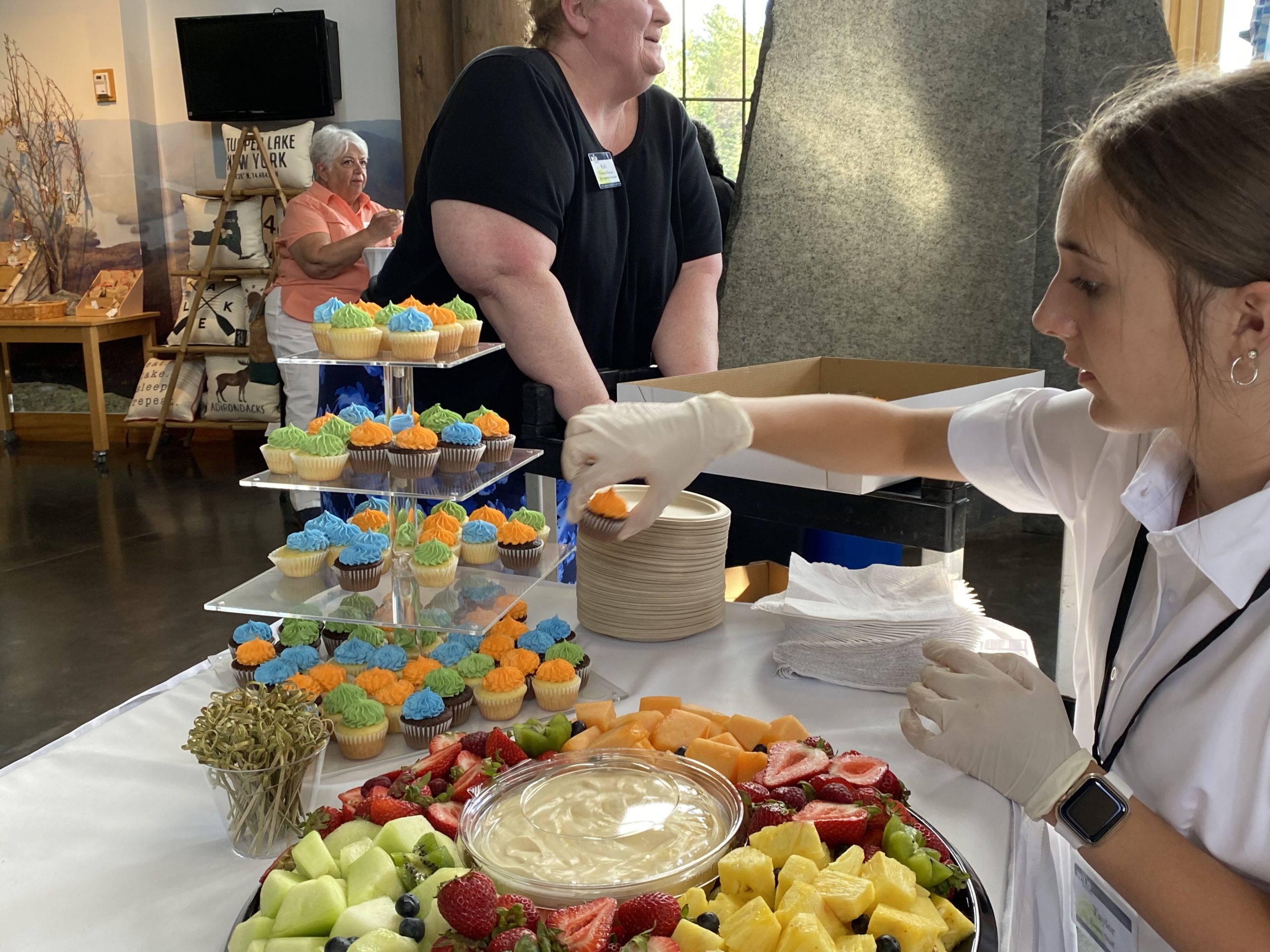 Image of snack table and multi-colored cupcakes