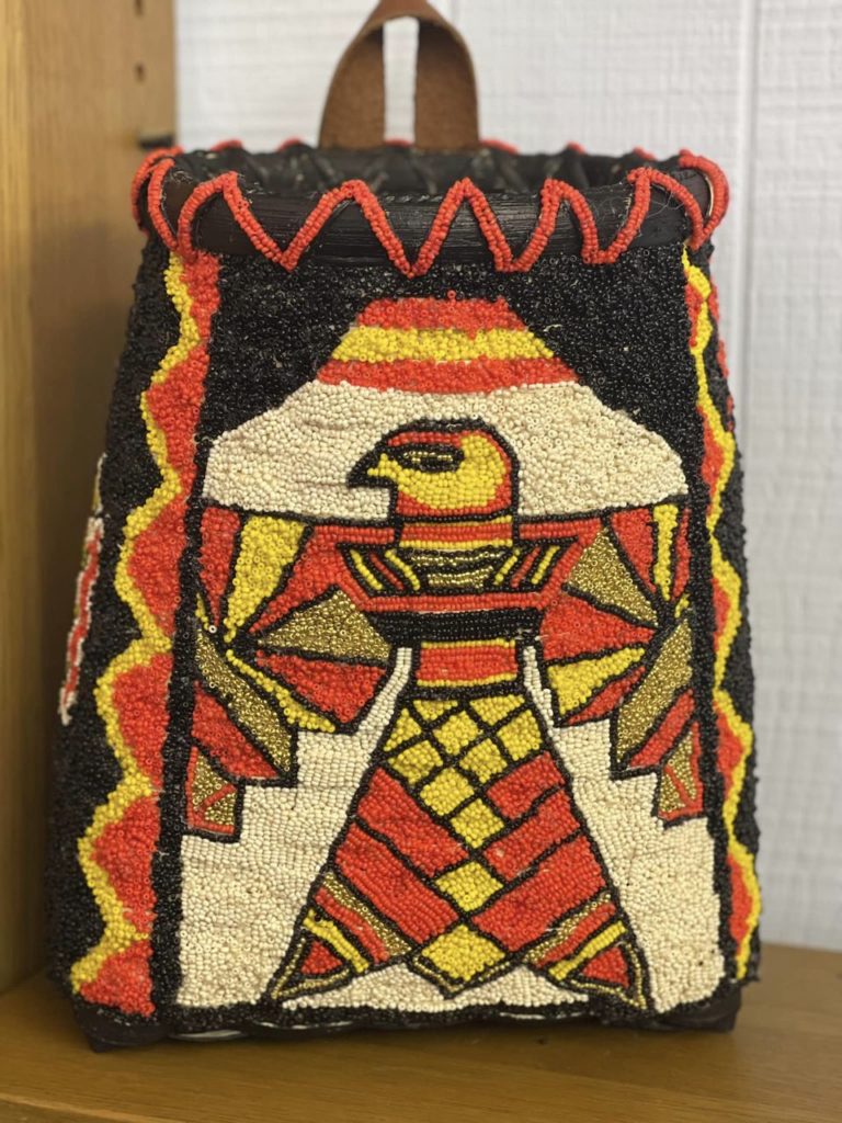 Photo of pack basket with Native American image of an eagle