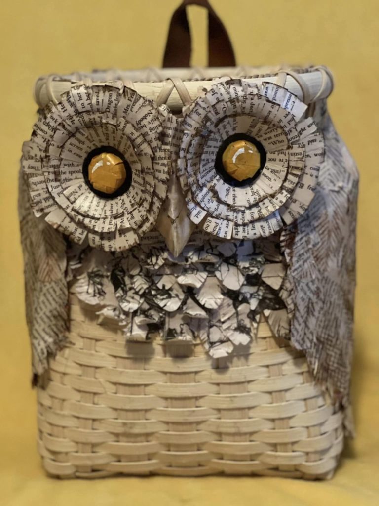 Photo of pack basket with owl decoration on the front