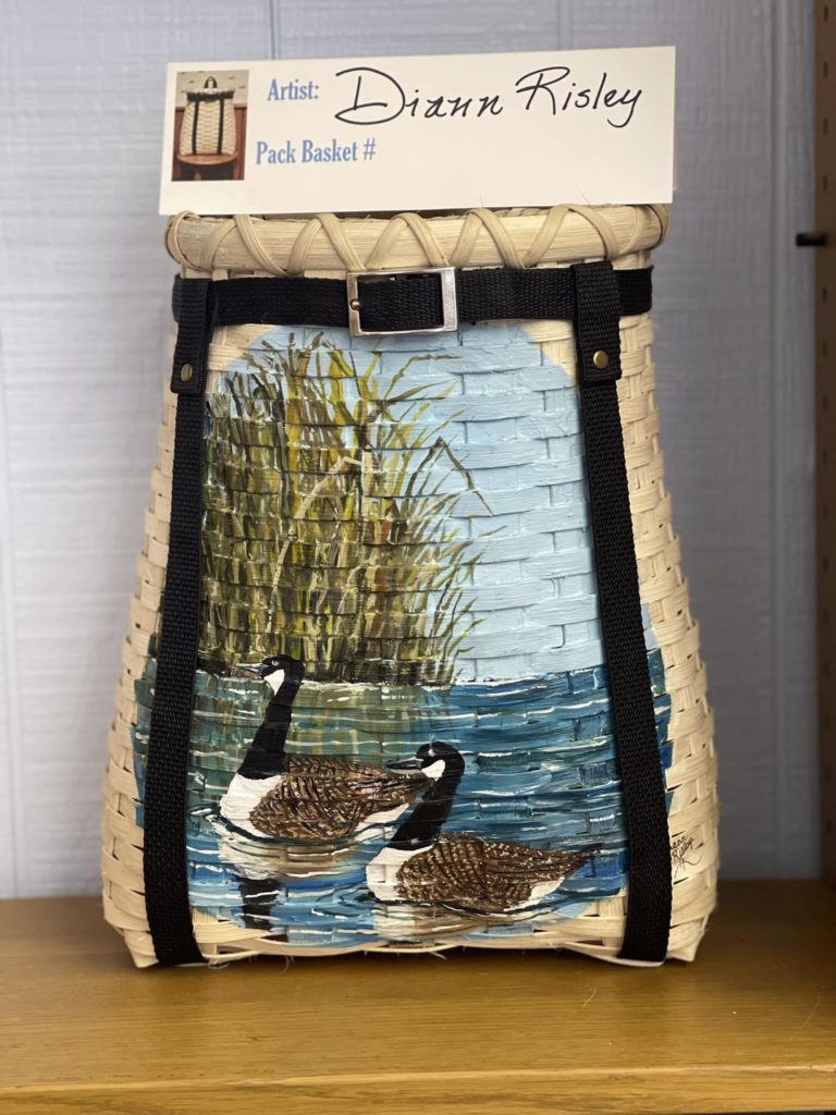 Photo of pack basket with Canadian Geese painted on the front.